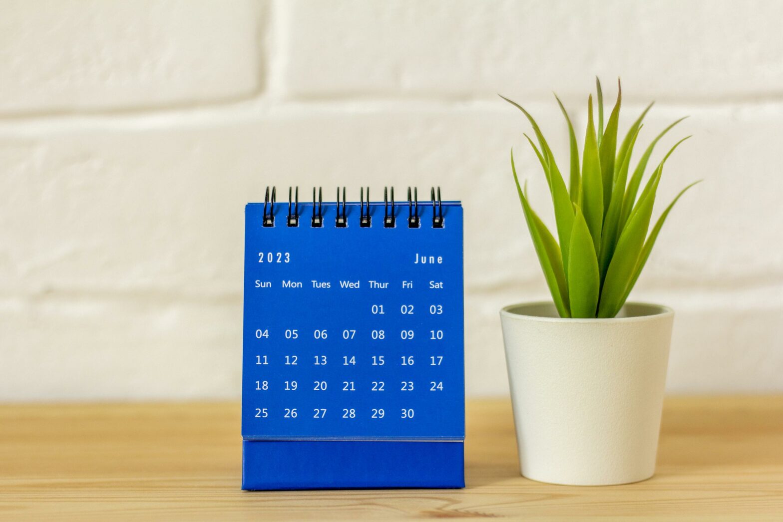 June 2023 desktop calendar for planning on the table